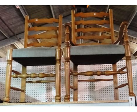 A set of six 20th century oak ladder back dining chairs, to include two carvers, (6).  M3