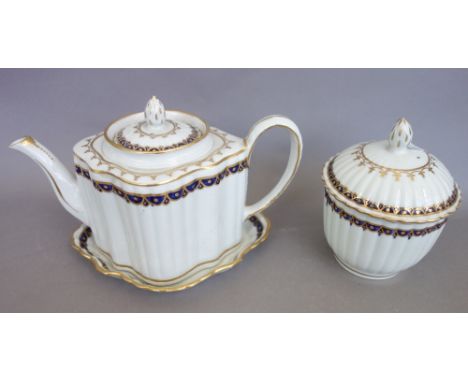 A New Hall fluted part tea service, circa 1785-90, painted in blue and gilt with pattern `155', comprising; a silver-shaped t