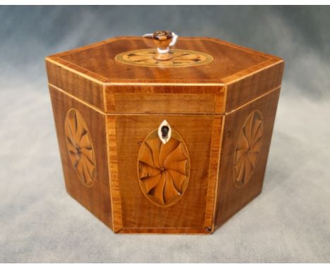 A George III boxwood strung marquetry inlaid harewood tea caddy, of compressed octagonal form, 16cm wide x 14cm high x 9cm de