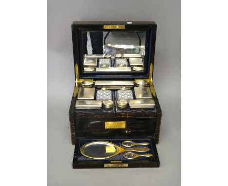 A Victorian silver gilt and gilt base metal mounted, coromandel wood travelling dressing/toilet case, fitted with a mirror wi