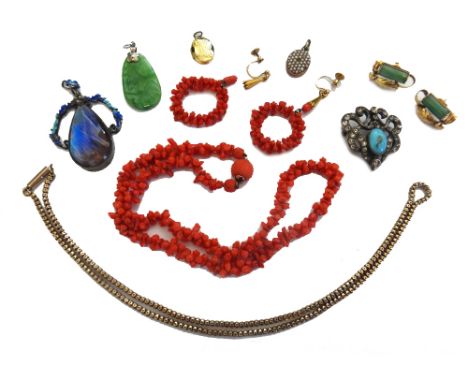 A gold multiple link neckchain, detailed 9 C, on a cylindrical clasp, weight 7.1 gms, a branch coral necklace, on a carved co