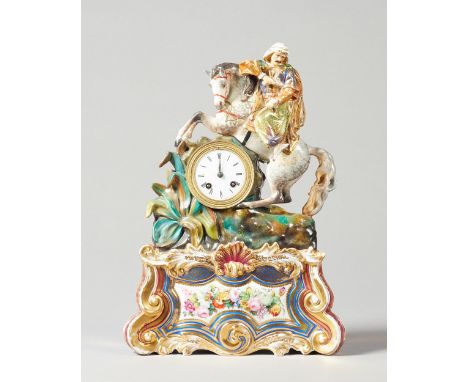 A French porcelain mantel clockIn the style of Jacob Petit, circa 1860 Modelled with an equestrian figure of an arab hunter, 