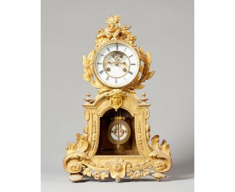 A French giltmetal mantel clockcirca 1870The case surmounted by a floral spray above the glazed bezel, the white enamel dial 