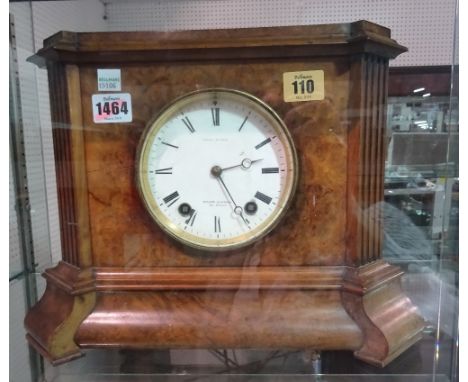 A French walnut eight day mantel clock, the white enamel dial detailed 'Wilson & Gandar, 392 Strand', the rectangular fluted 