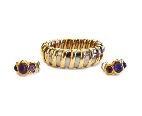 A pair of gold and cabochon amethyst earclips, each in a curved design, mounted with three oval cabochon amethysts, the repla