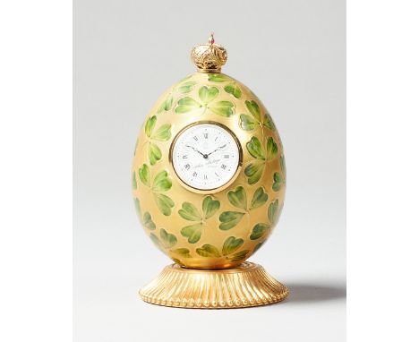 A Modern giltmetal and enamel Clover Egg timepieceBy Theo Faberge, England, No. 187 of 750The egg-shaped case surmounted by a