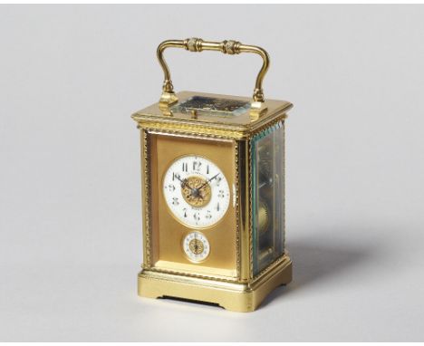 A French brass carriage clock Circa 1910In a corniche type case with decoration, the knopped engine turned handle above bevel