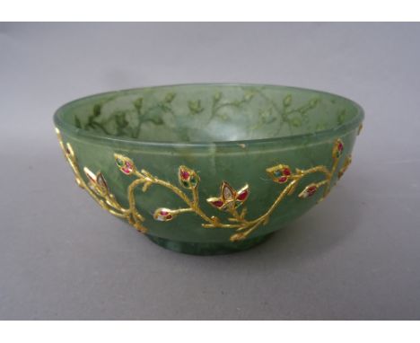 A gold and gem set inlaid jade bowl, India, early 20th century, decorated to the exterior with a floral band, 13.5cm diameter