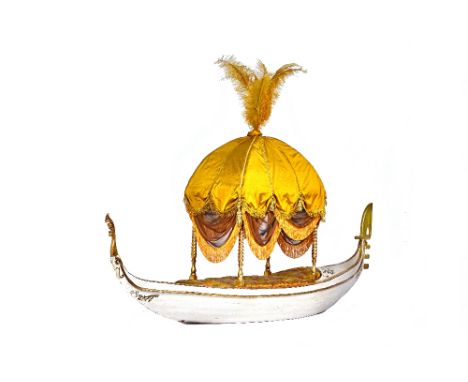 A dog bed, in the form of a cream and parcel gilt gondola, with gold fabric onion top and button padded seat, 65cm wide x 290