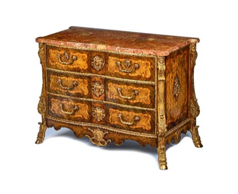 A Louis XIV style commode, the shaped marble top with outstepped rounded corners, over a gilt metal mounted parquetry and mar