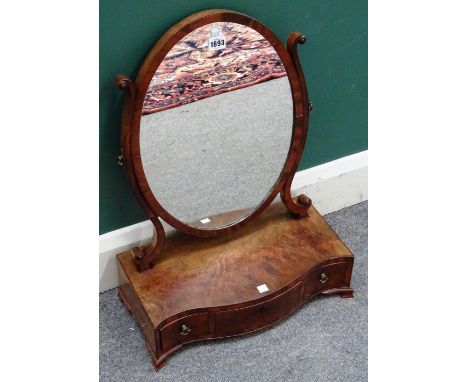 A George III mahogany toilet mirror, with serpentine three drawer base, on pointed ogee bracket feet, 45cm wide x 59cm high