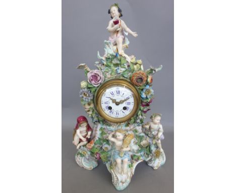A Meissen flower encrusted clock, late 19th century, the white enamel dial painted with flower swags, the rococo moulded case