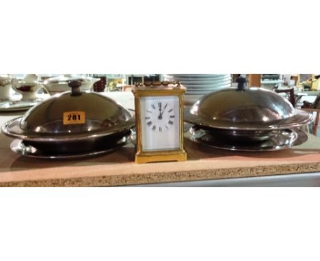A pair of 20th century Keswick school beaten steel lidded bowls, and a brass cased carriage clock, (3).  S3T