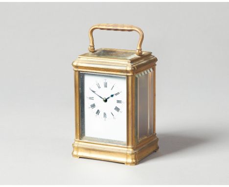 A French brass carriage timepieceCirca 1890In a gorge case, with white enamel dial, the movement No. 22677, with original pla