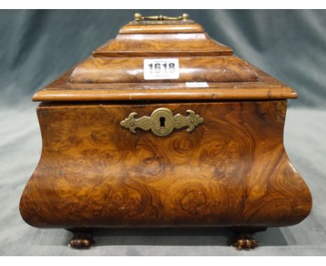 A 19th century and later figured walnut square tea caddy, of bloated bombé form, the lift top enclosing four lidded canisters