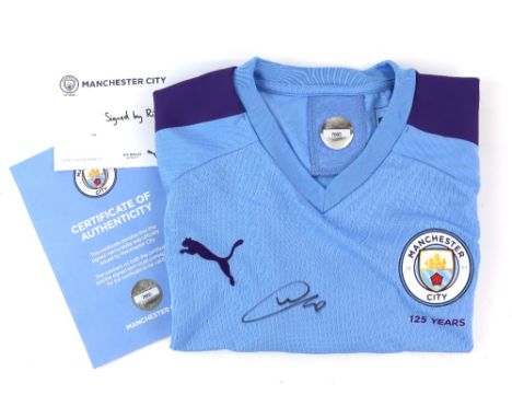 Football - Manchester City Home Shirt signed by Riyad Mahrez, size Medium.Provenance: With Certificate of Authenticity from M