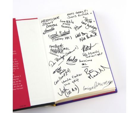 Harry Potter and the Philosopher's Stone - Hardback book, signed to inside pages by 26 members of the cast including - Daniel