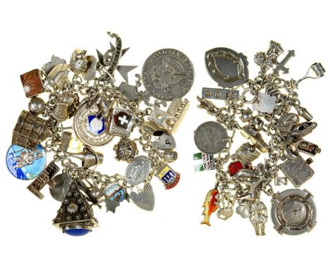 TWO SILVER CHARM BRACELETS, 8OZS Both bracelets in good second hand condition with light wear only, several charms unmarked b