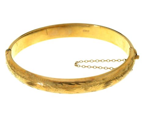 A 9CT GOLD BANGLE, FOLIATE ENGRAVED, 68MM W, BIRMINGHAM 1954, 11.5G No play in hinge, not dented or split, light wear scratch