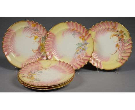 A SET OF SIX ROYAL WORCESTER SHELL MOULDED SHOT ENAMEL DESSERT PLATES, PRINTED AND PAINTED WITH IRIS AND OTHER FLOWERS ON A S