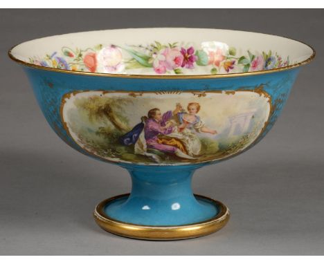 A FRENCH PORCELAIN FOOTED BOWL IN SEVRES STYLE, PAINTED IN BRIGHT ENAMEL WITH FLOWERS, ON THE EXTERIOR RESERVED ON A BLUE CEL