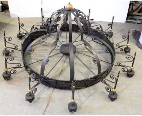 A GOTHIC STYLE WROUGHT IRON TWELVE BRANCH CHANDELIER OF UNUSUAL SIZE, APPROXIMATELY 240CM D X 110CM H AND A SIMILAR SIX BRANC