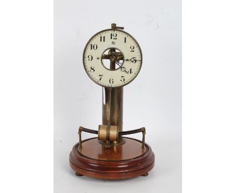 Bulle electric mantel clock, the white dial enclosing a skeletonised centre, with a cylindrical brass battery column, raised 