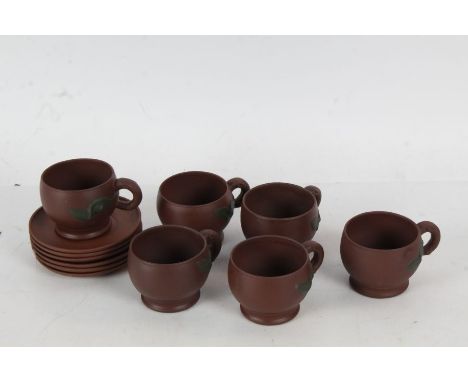 A 20th century Chinese pottery tea set, the brown pottery tea set decorated with a leaf, six saucers six cups (12)&nbsp;