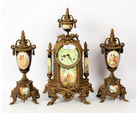 Decorative porcelain and gilt clock garniture, set with porcelain panels depicting courting couples, 42cm high&nbsp;