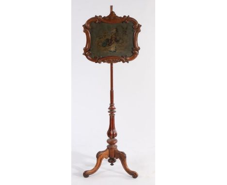 Victorian rosewood pole screen, the adjustable glazed screen with scrolled border and central needlework panel depicting a yo