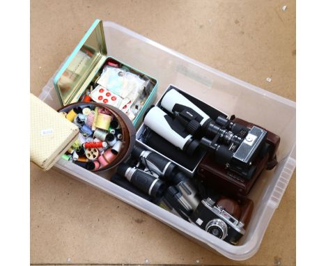 A quantity of Vintage binoculars and cameras, including Tasco and Halina, 2 boxes of sewing materials, cotton and buttons als