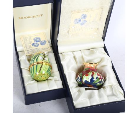 A boxed Moorcroft miniature enamel vase, 4.5cm, and a boxed Moorcroft egg design box 