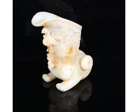 A Chinese white jade libation cup, with phoenix decoration, height 18cmGood overall condition, no chips. Some visible hairlin