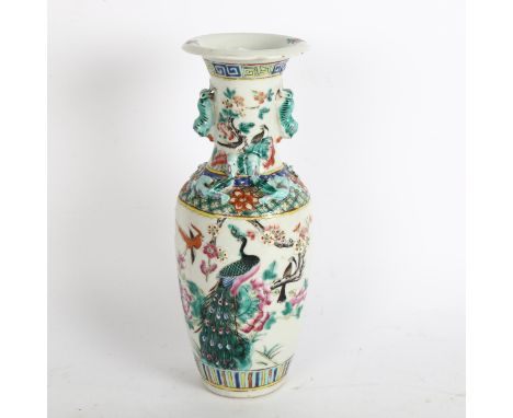 A Chinese famille verte vase with enamel peacock decoration, height 30cmVase has a hairline crack running down through the bo