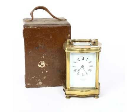 An Antique brass-cased carriage clock, by Stewart & Co of London, shaped case with white enamel dial, Roman numeral hour mark