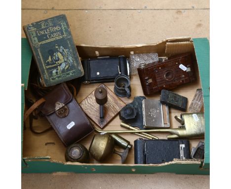 An Oriental brass opium pipe, oak-framed barometer, folding cameras, desk stand, and Uncle Tom's Cabin, by Harriet Beecher St