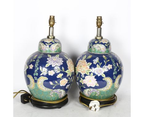 A pair of Oriental ceramic table lamps with enamelled decoration, height overall 45cm 