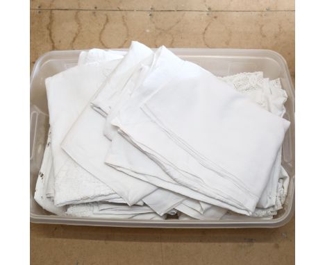 A box of Vintage table cloths, including lace-trimmed and crocheted 