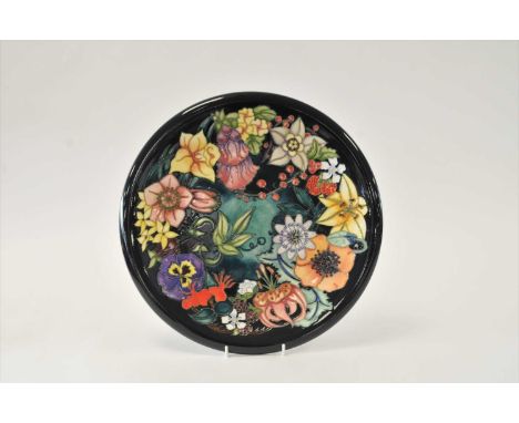 A large Moorcroft charger decorated in the Carousel pattern designed by Rachel Bishop, impressed and painted marks, a numbere
