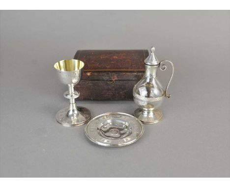 A matched three piece Victorian silver travelling communion set, comprising; a chalice and vessel hallmarked Henry Wilkinson 