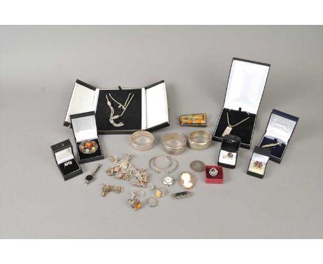 A collection of jewellery, to include; silver bangles, a silver Albert, silver charm bracelets, a jade panel ring ,a Tigers e