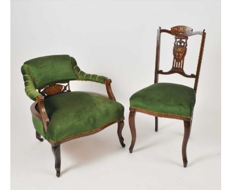 An Edwardian inlaid mahogany salon suite, covered in green draylon, comprising chaise lounge / sofa, two armchairs and five s