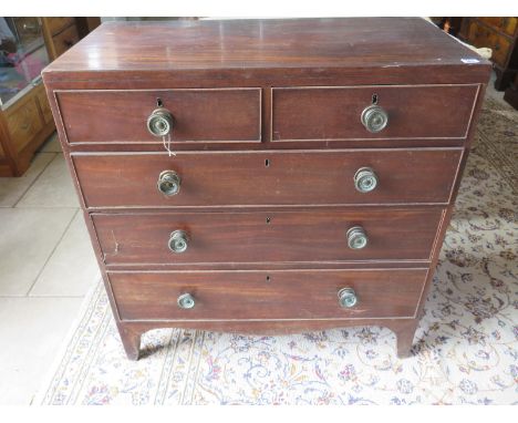 A Georgian mahogany chest with two short over three long drawers, on bracket feet, requiring general restoration - 92cm W x 9