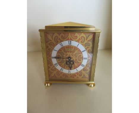 A Saint Blaise gilt metal manual wind mantle clock in clean running condition - 12cm H x 10cm 