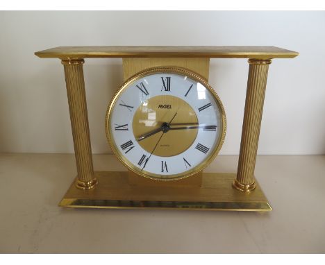 A Rigel Quartz gilt metal mantle clock - 14cm H x 20cm - running 