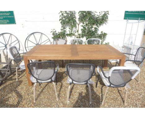 A Bramblecrest Batu Vintage teak table and eight gun metal grey steel mesh armchairs with cushions 