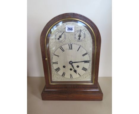 An 8 day oak case three train chiming bracket clock, silvered dial, strike/silent, fast/slow 