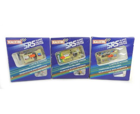 Three Scalextric SRS cars with boxes, comprising a Porsche 956 (C018) and two Peugeot 205 Turbo 16 (C017), all in a playworn 
