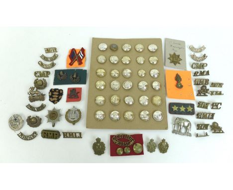 A group of over sixty British Army badges and buttons, including shoulder titles for the Royal Marines, Cheshire and Royal Be