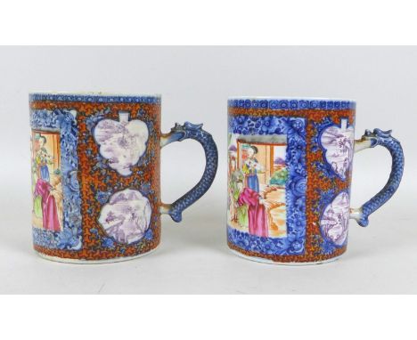 A pair of Chinese Export porcelain tankards, Qing Dynasty, early 19th century, decorated in underglaze blue and famille rose 